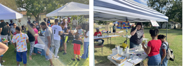 Outdoor community event with people gathered under white tents. On the left, attendees enjoy food. On the right, a woman engages with visitors at a display table.